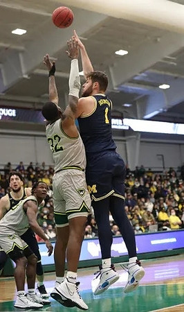 Brandon Johns Jr. (23) and Hunter Dickinson (1)
