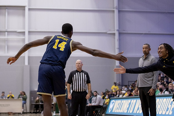 Moussa Diabate (14) and Juwan Howard