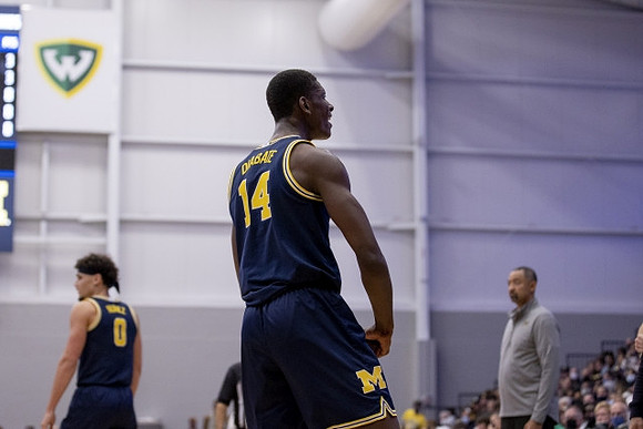 Moussa Diabate (14), Adrien Nunez (0), and Juwan Howard