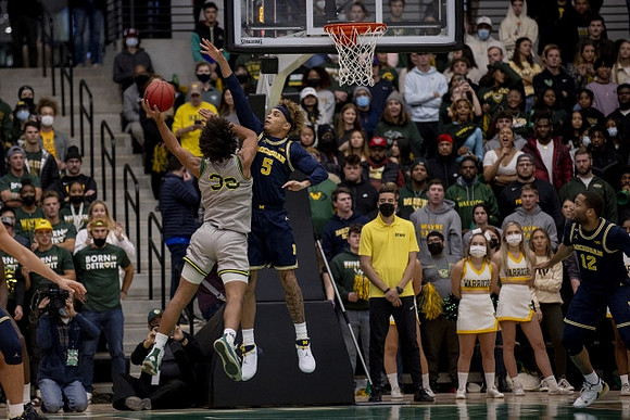 Terrance Williams II (5) and DeVante' Jones (12)