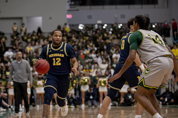 DeVante' Jones (12) and Adrien Nunez (0)