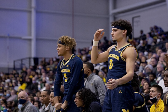 Terrance Williams II (5), Adrien Nunez (0), and Michigan Team