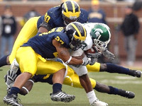 Tim Jamison (90) and Brandon Harrison (27)