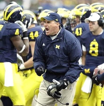 Rich Rodriguez, Brandon Minor (4), Mark Moundros (44), Zoltan Mesko (41), and Nick Sheridan (8)