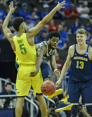 Derrick Walton Jr. (10) and Moritz Wagner (13)