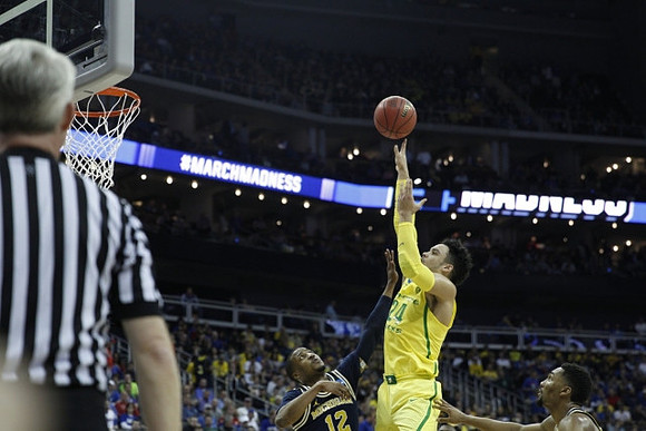 Muhammad-Ali Abdur-Rahkman (12) and Zak Irvin (21)