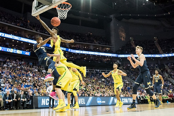 Muhammad-Ali Abdur-Rahkman (12), Moritz Wagner (13), and Derrick Walton Jr. (10)