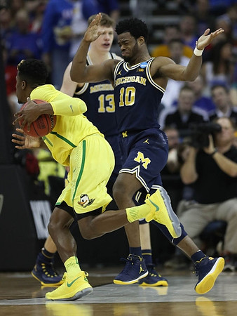Moritz Wagner (13) and Derrick Walton Jr. (10)