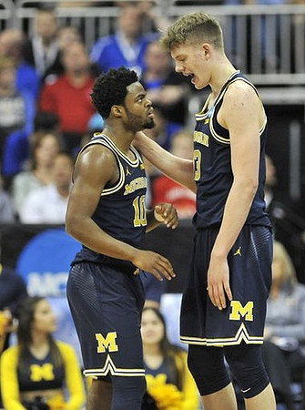 Derrick Walton Jr. (10) and Moritz Wagner (13)