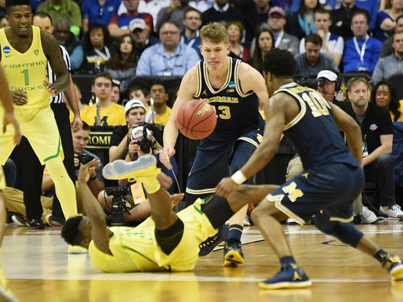 Moritz Wagner (13) and Derrick Walton Jr. (10)