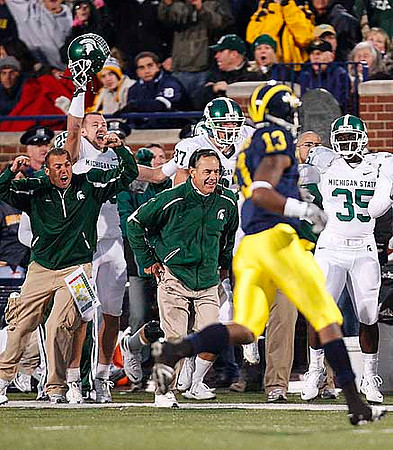 Greg Mathews (13) and Mark Dantonio