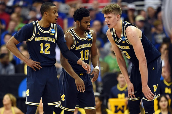 Muhammad-Ali Abdur-Rahkman (12), Derrick Walton Jr. (10), and Moritz Wagner (13)