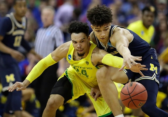 D.J. Wilson (5) and Muhammad-Ali Abdur-Rahkman (12)