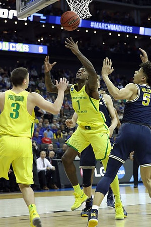 D.J. Wilson (5) and Moritz Wagner (13)