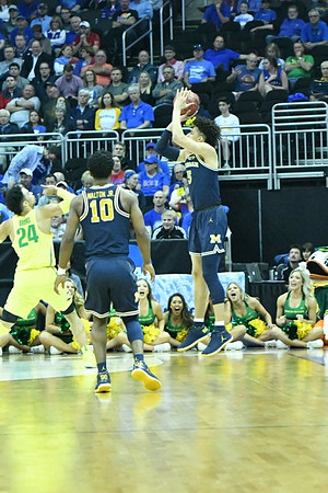 Derrick Walton Jr. (10) and D.J. Wilson (5)