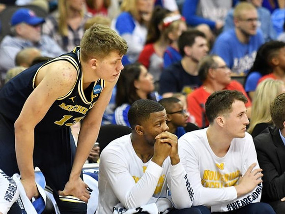 Moritz Wagner (13), Xavier Simpson (3), and Andrew Dakich (11)