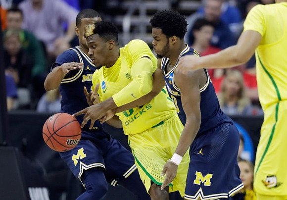 Muhammad-Ali Abdur-Rahkman (12) and Derrick Walton Jr. (10)