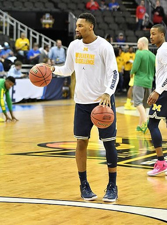 Zak Irvin (21) and Muhammad-Ali Abdur-Rahkman (12)