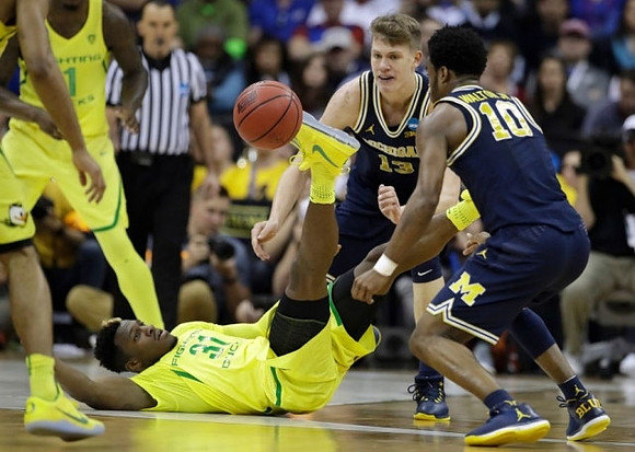 Moritz Wagner (13) and Derrick Walton Jr. (10)
