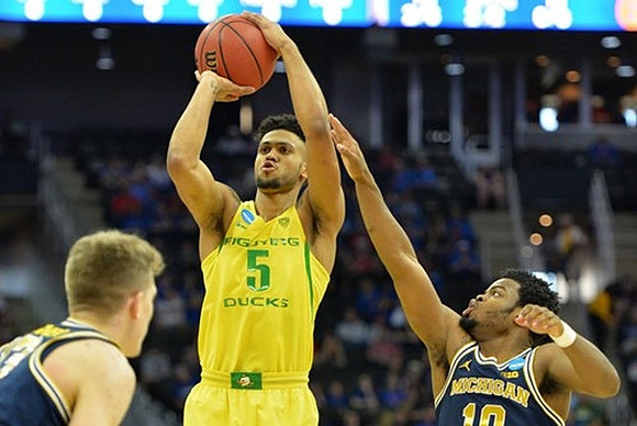 Moritz Wagner (13) and Derrick Walton Jr. (10)