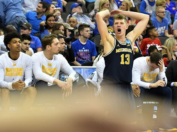 Ibi Watson (23), Mark Donnal (34), Moritz Wagner (13), and Andrew Dakich (11)