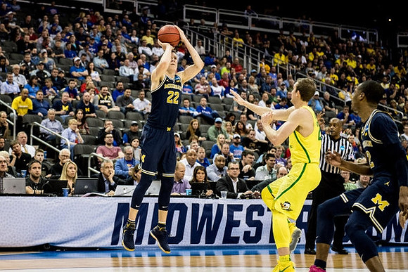 Duncan Robinson (22) and Muhammad-Ali Abdur-Rahkman (12)