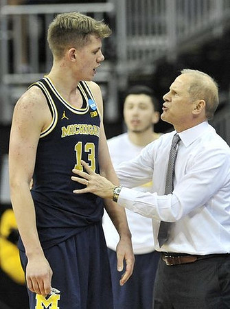 Moritz Wagner (13) and John Beilein
