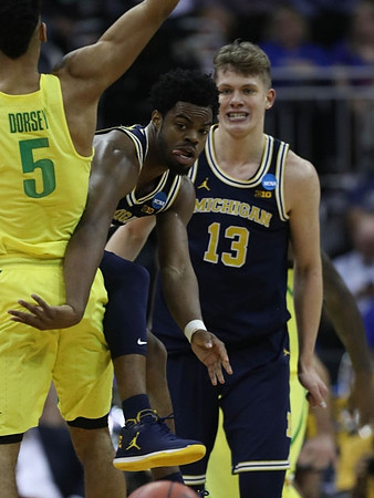 Derrick Walton Jr. (10) and Moritz Wagner (13)