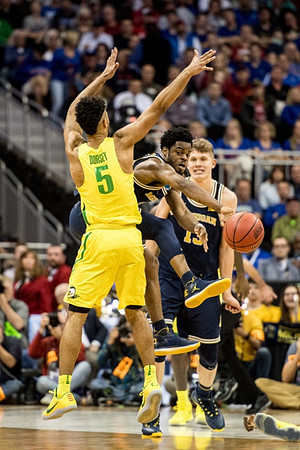 Derrick Walton Jr. (10) and Moritz Wagner (13)
