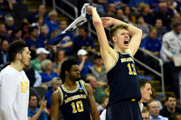 Brent Hibbitts (0), Derrick Walton Jr. (10), and Moritz Wagner (13)