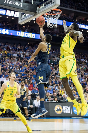 Derrick Walton Jr. (10) and Zak Irvin (21)
