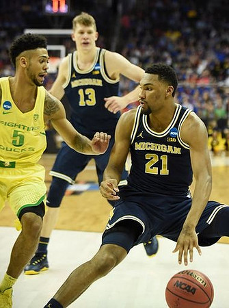 Moritz Wagner (13) and Zak Irvin (21)