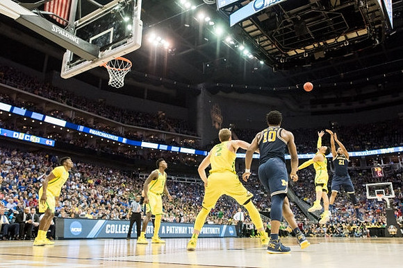 Derrick Walton Jr. (10) and Zak Irvin (21)