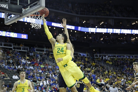 Derrick Walton Jr. (10) and Moritz Wagner (13)