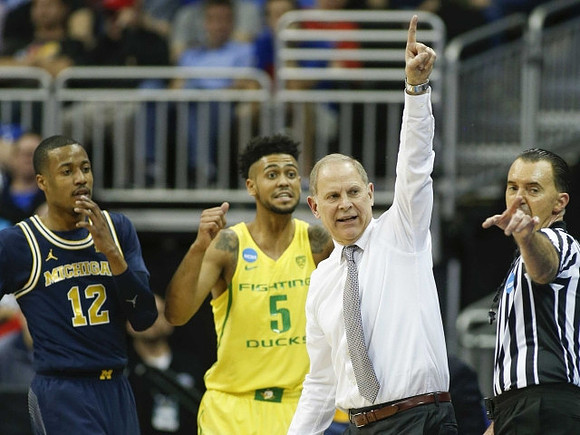 Muhammad-Ali Abdur-Rahkman (12) and John Beilein