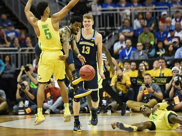 Derrick Walton Jr. (10) and Moritz Wagner (13)