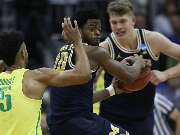 Derrick Walton Jr. (10) and Moritz Wagner (13)