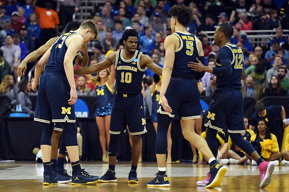 Moritz Wagner (13), Derrick Walton Jr. (10), D.J. Wilson (5), and Muhammad-Ali Abdur-Rahkman (12)