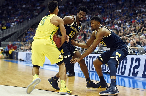Derrick Walton Jr. (10) and Zak Irvin (21)