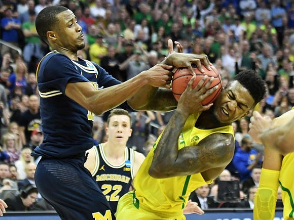 Muhammad-Ali Abdur-Rahkman (12) and Duncan Robinson (22)