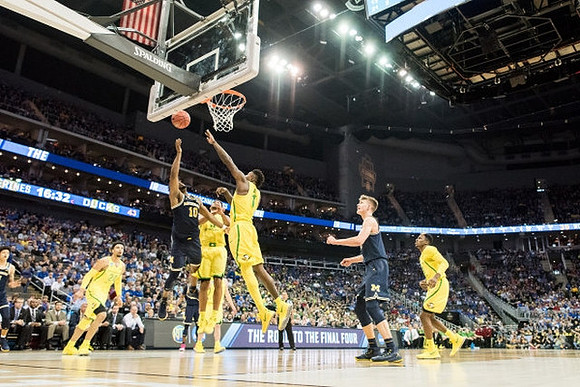 Derrick Walton Jr. (10) and Moritz Wagner (13)
