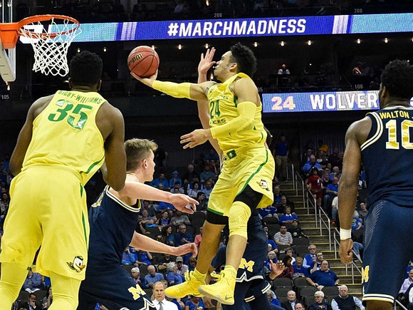 Moritz Wagner (13) and Derrick Walton Jr. (10)