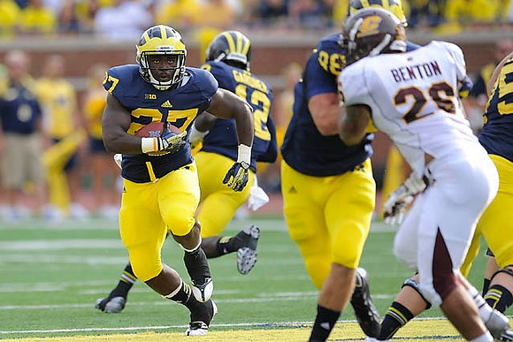 Derrick Green (27), Devin Gardner (12), and Jake Butt (88)