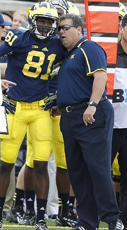 Csont'e York (81) and Brady Hoke