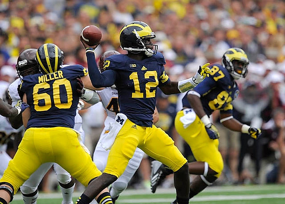 Jack Miller (60), Devin Gardner (12), and Devin Funchess (87)
