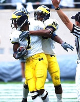 Braylon Edwards (1) and Chris Perry (23)