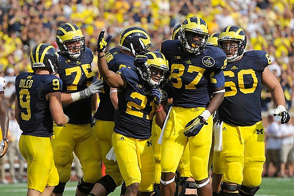Drew Dileo (9), Michael Schofield (75), Jeremy Gallon (21), Devin Funchess (87),and Jack Miller (60)