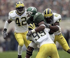 Pierre Woods (99), Jeremy LeSueur (21), and Lawrence Reid (42)
