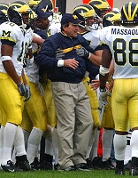 Lloyd Carr, Jermaine Gonzales (18), and Tim Massaquoi (88)