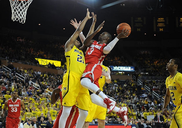 Zak Irvin (21) and Muhammad-Ali Abdur-Rahkman (12)